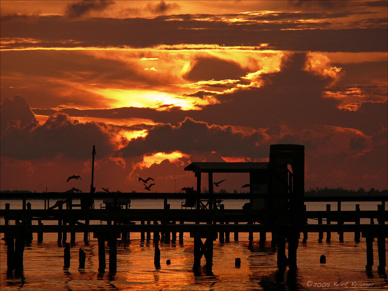 Silhouetted Pier at Sunset — Orange, Dramatic, Photograph, Birds
