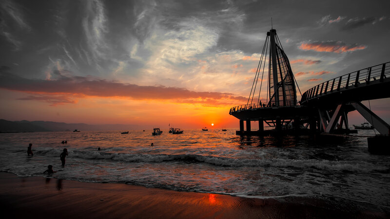 Silhouetted Pier at Sunset — Orange, Dramatic, Photograph, Ocean, Boats