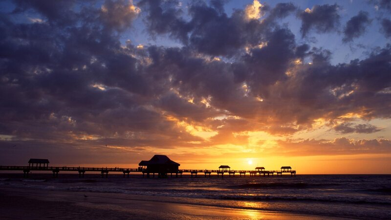 Silhouetted Pier at Sunset — Orange, Dramatic, Photograph, Ocean, Clouds, Sun
