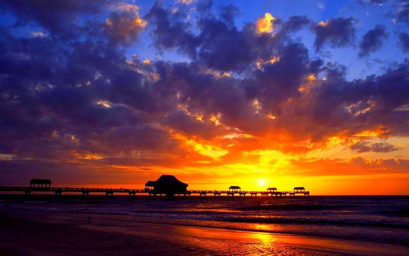 Silhouetted Pier at Sunset — Orange, Dramatic, Photograph, Ocean, Clouds