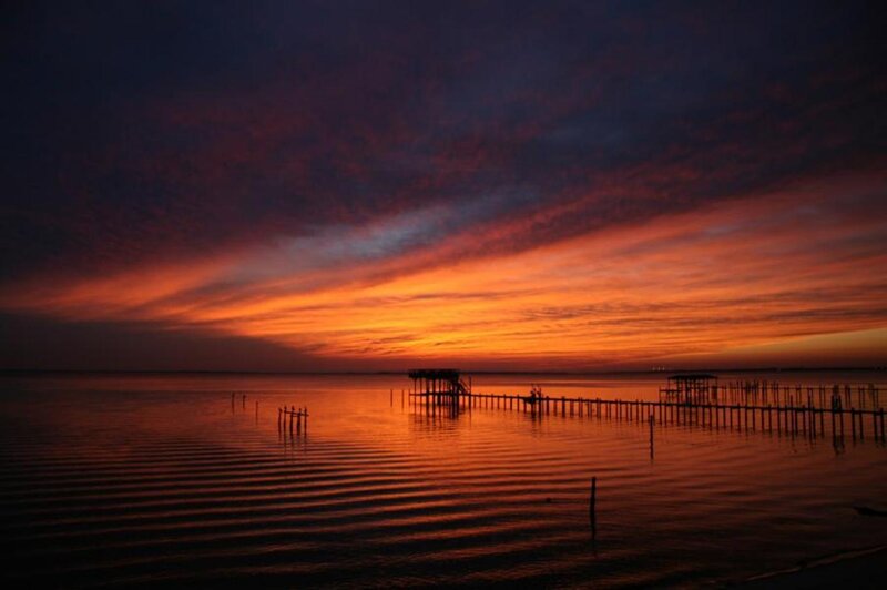Silhouetted Pier at Sunset — Orange, Dramatic
