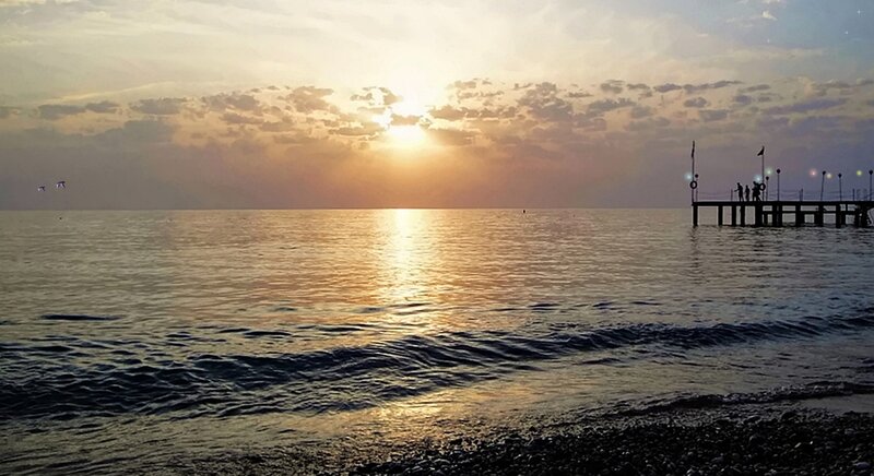 Silhouetted Pier at Sunset — Orange, Serene, Photograph, Sun