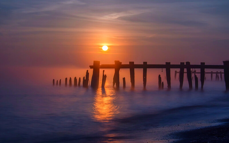 Silhouetted Pier at Sunset — Orange, Serene, Photograph