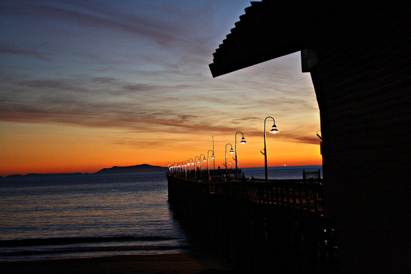 Silhouetted Pier at Sunset — Orange