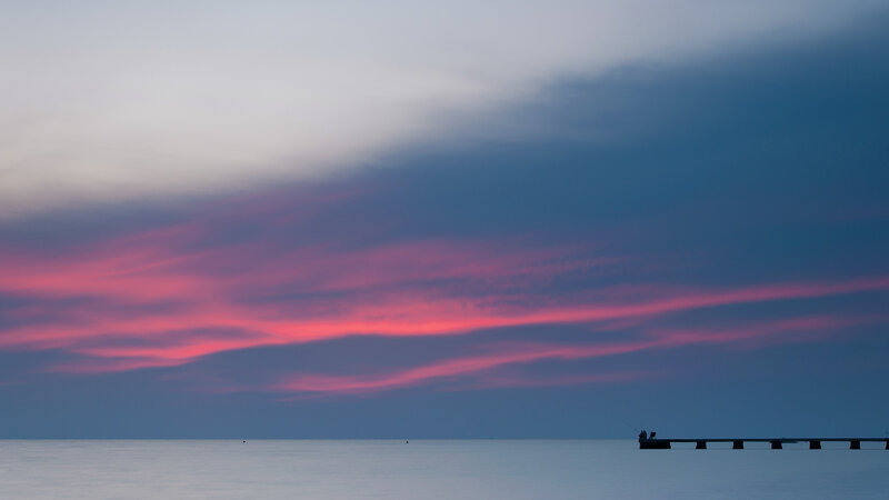 Silhouetted Pier at Sunset — Pink, Serene