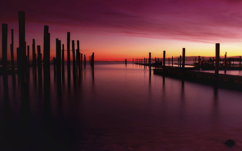 Silhouetted Pilings at Sunset — Purple