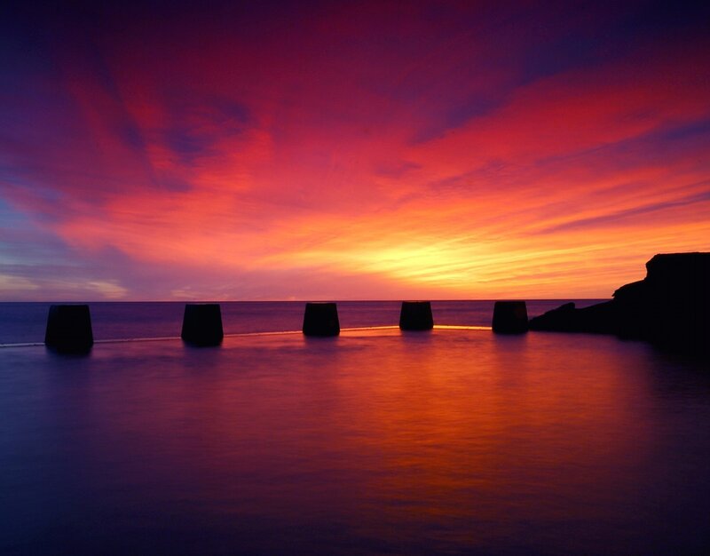 Silhouetted Pillars at Sunset — Red