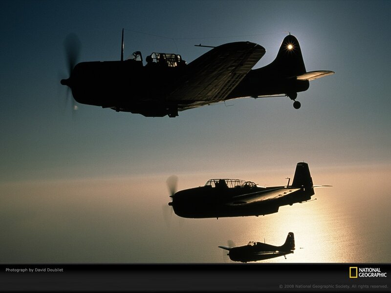 Silhouetted planes in formation