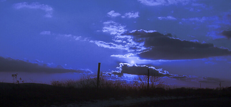 Silhouetted Poles at Dusk — Blue