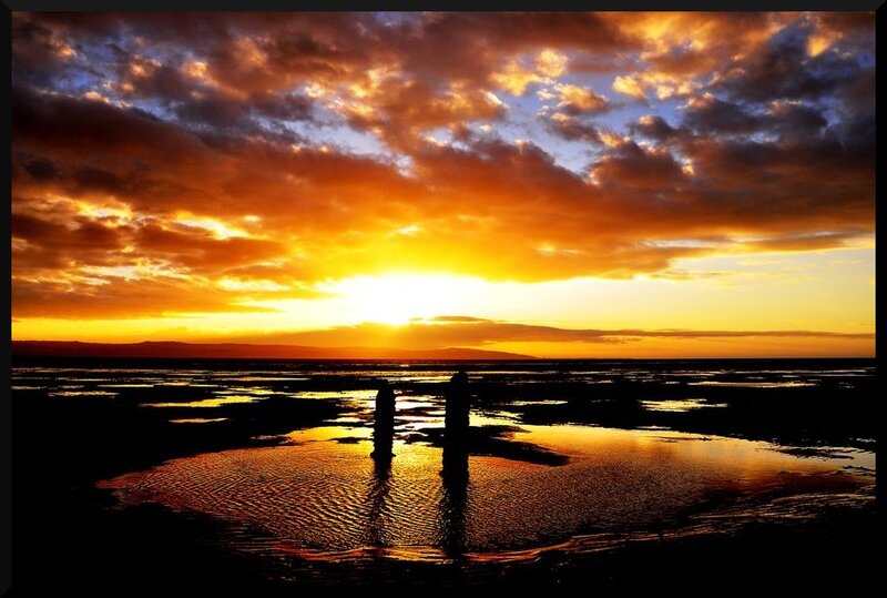 Silhouetted Posts at Sunset — Orange