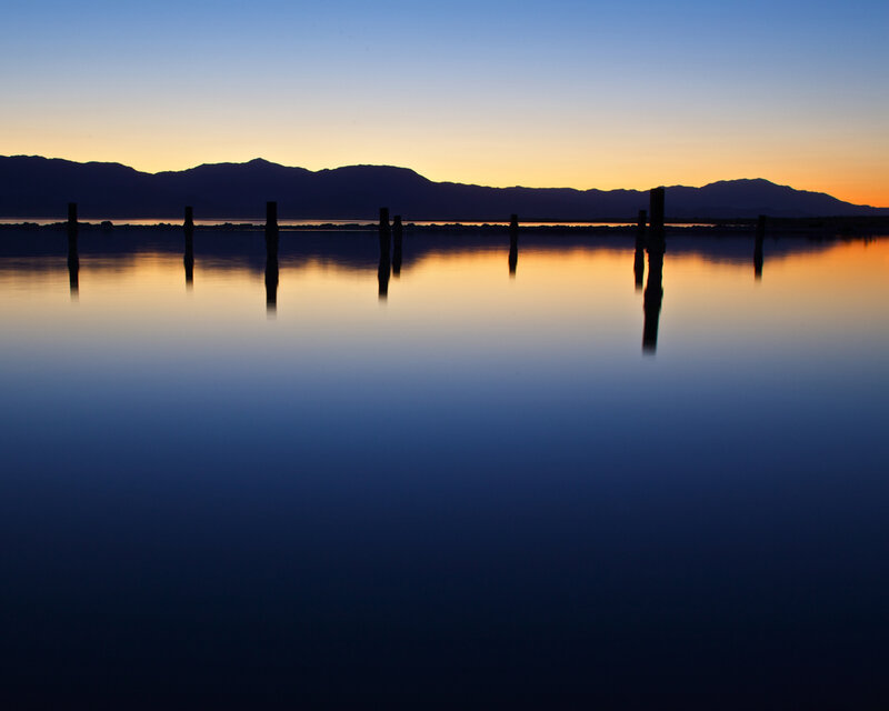 Silhouetted posts at sunset