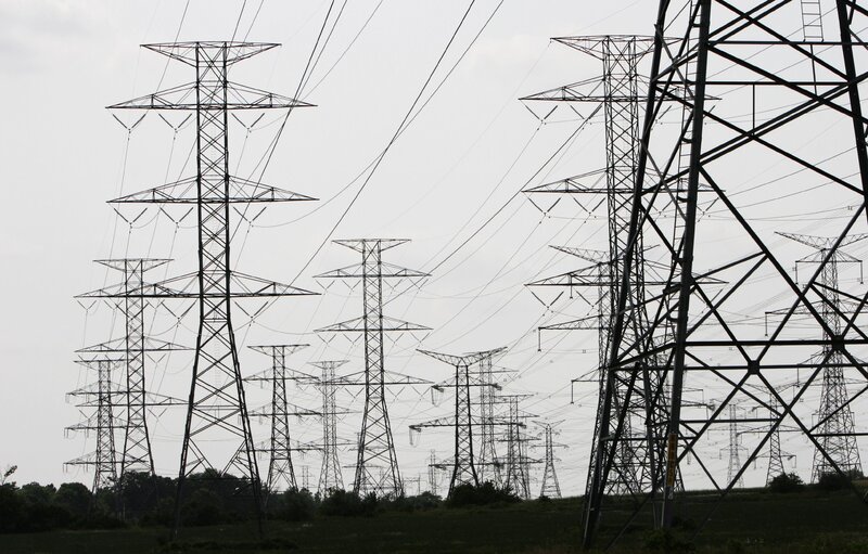 Silhouetted Power Line Towers