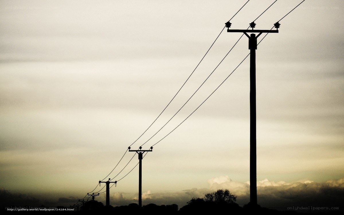 Silhouetted power lines at dusk
