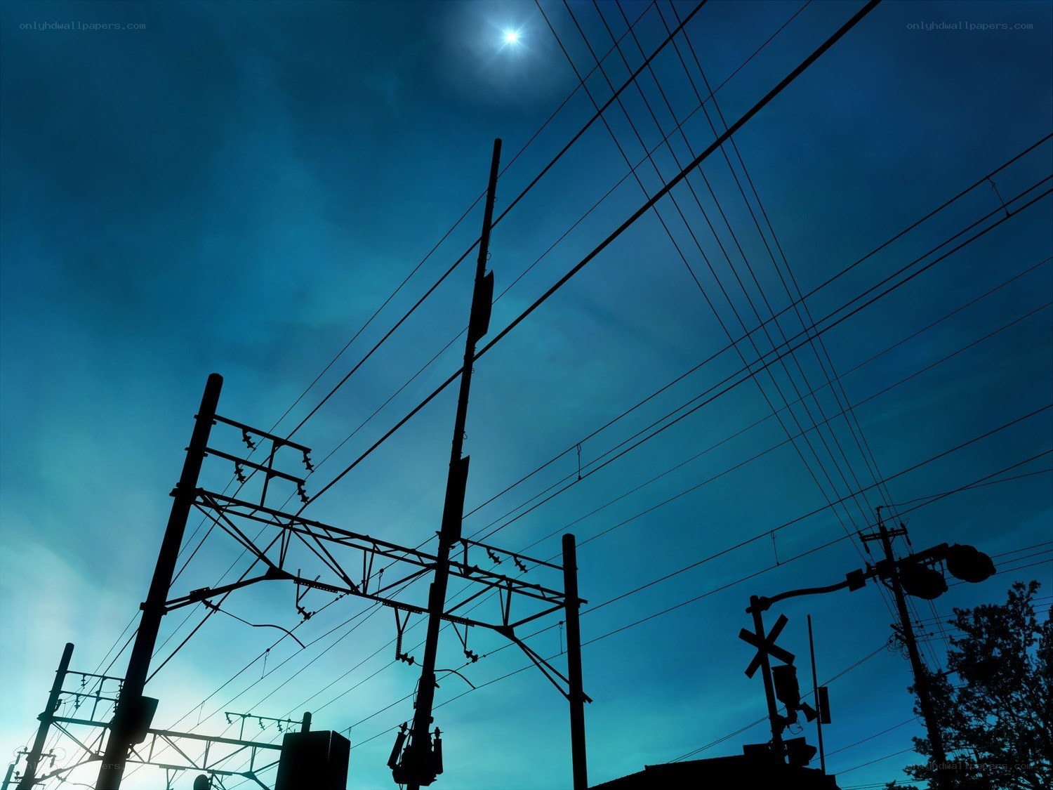 Silhouetted power lines at dusk