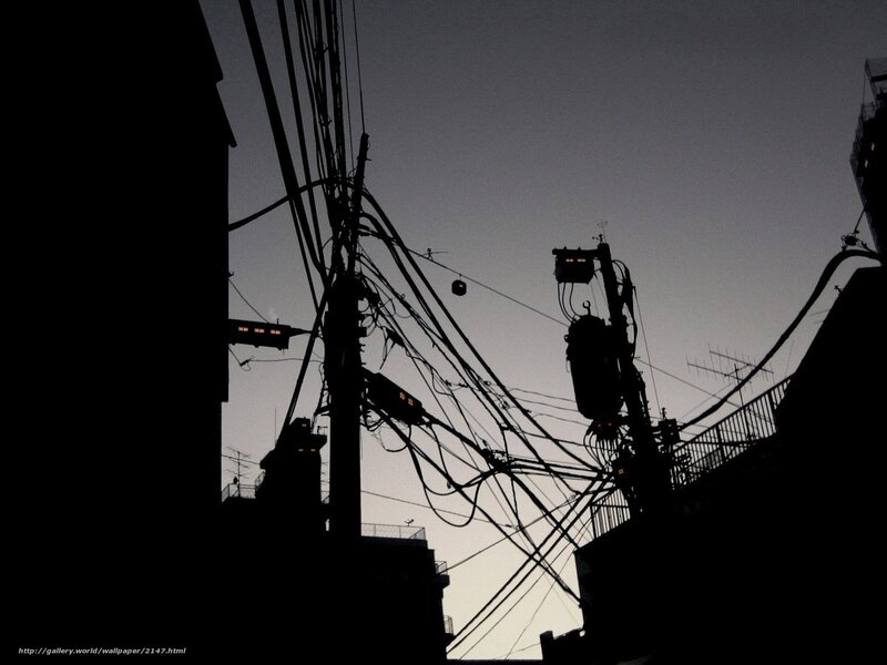 Silhouetted power lines at dusk