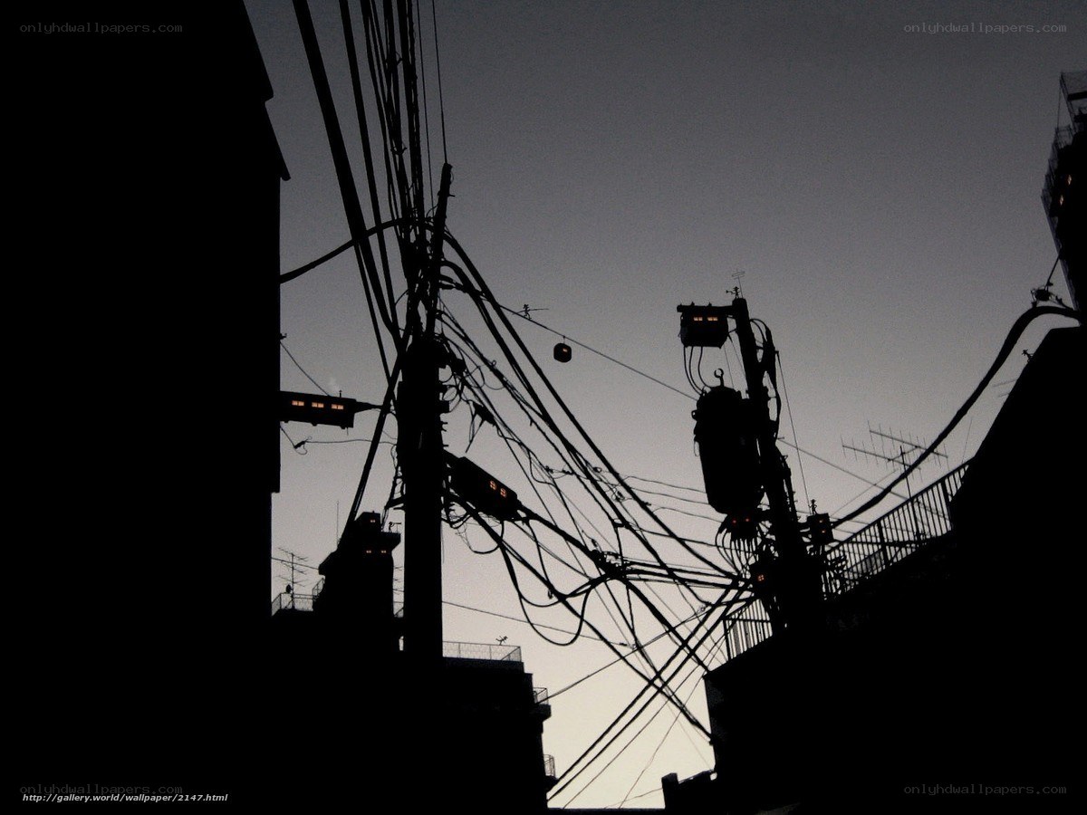 Silhouetted power lines at dusk