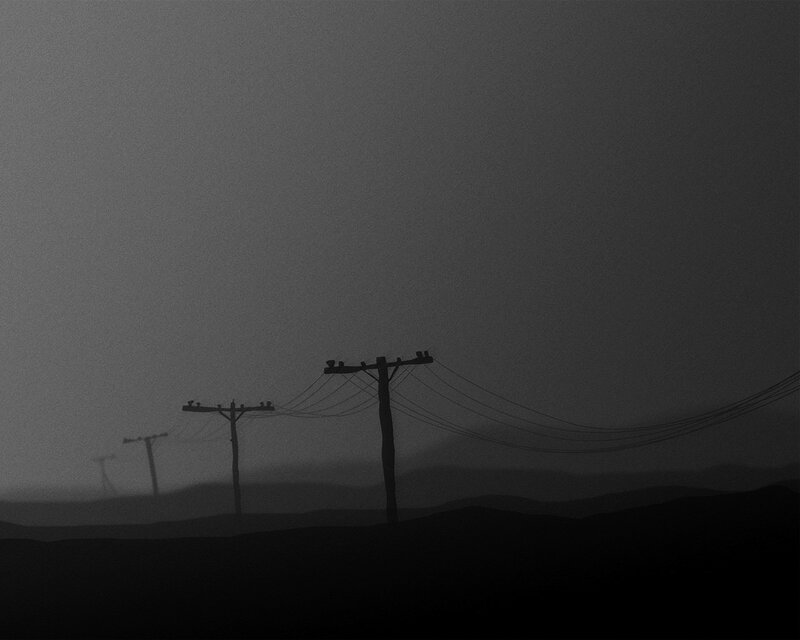 Silhouetted power lines in fog
