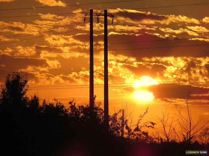 Silhouetted Power Poles — Orange