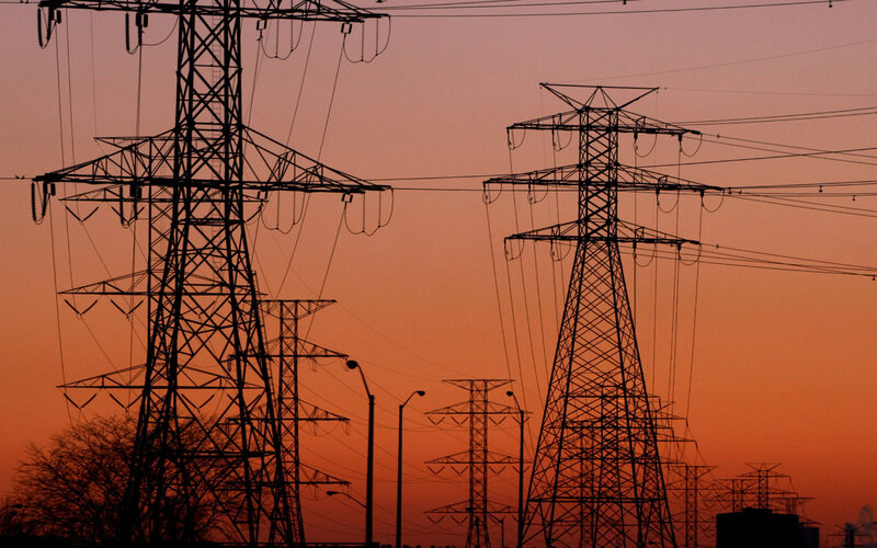 Silhouetted Power Towers — Orange, Dramatic, Sunset