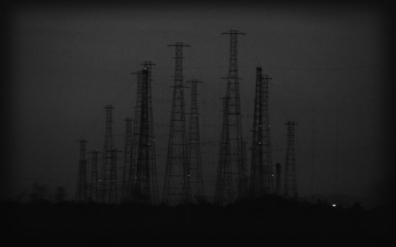 silhouetted power towers