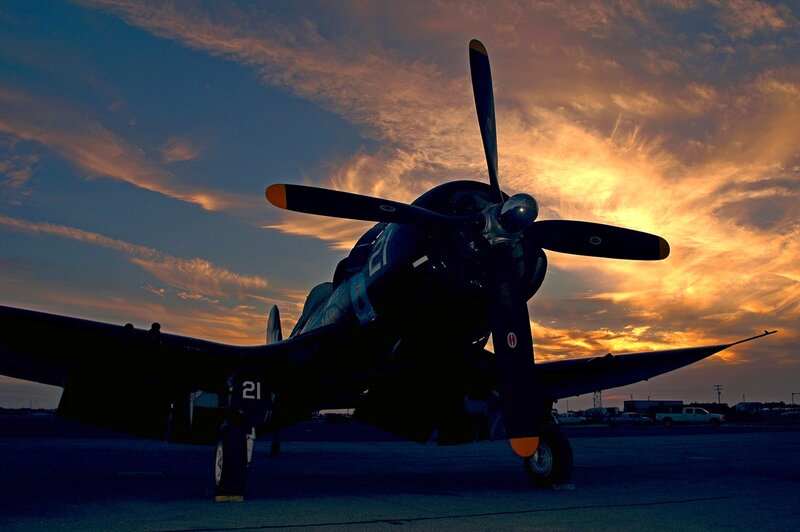 Silhouetted Propeller Plane