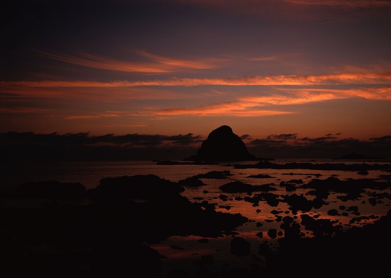 Silhouetted Rock at Sunset — Orange, Dramatic, Photograph