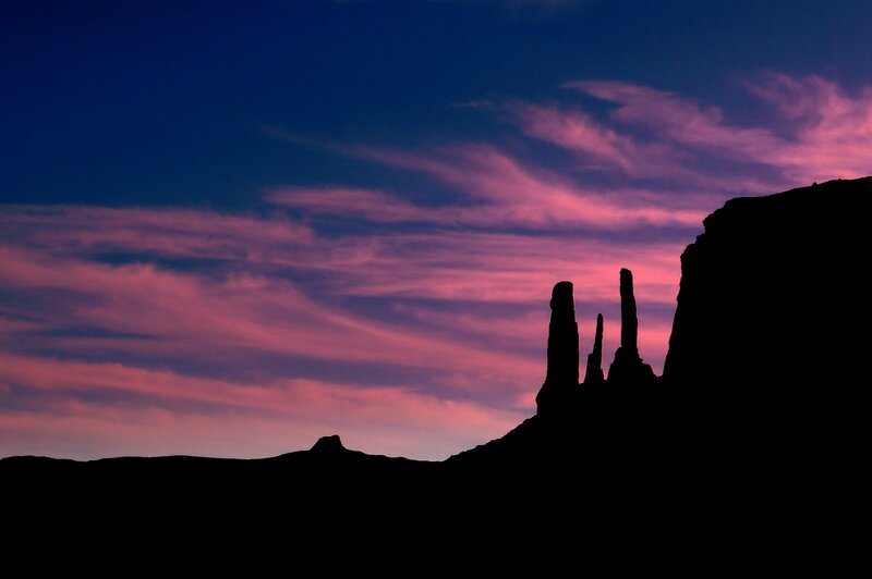 Silhouetted rock formations at dusk