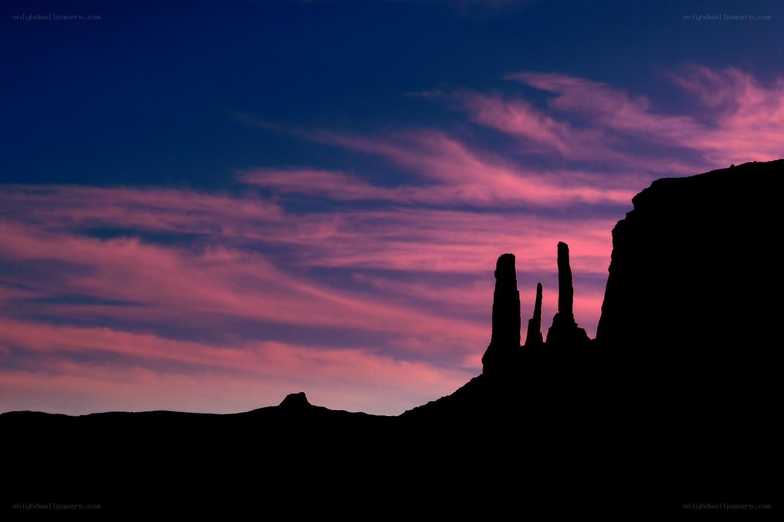 Silhouetted rock formations at dusk