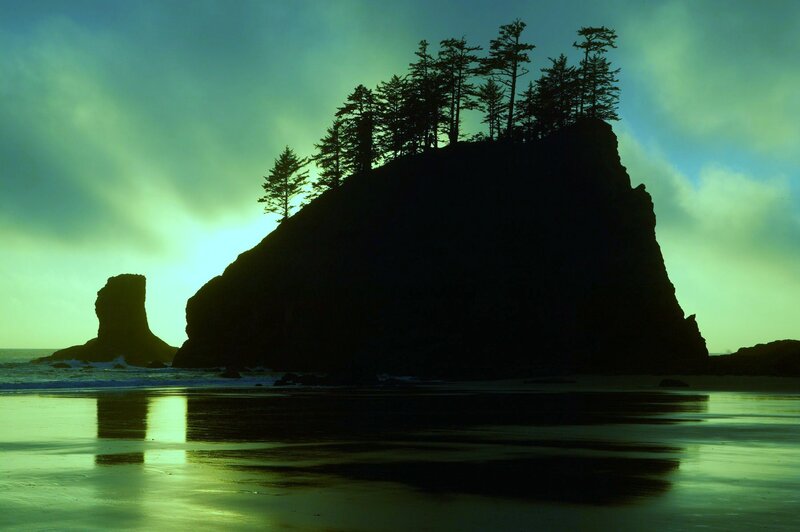 Silhouetted rock formations at sunset