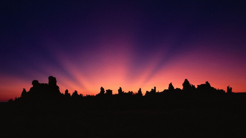 Silhouetted Rock Formations — Purple, Dramatic, Sunset
