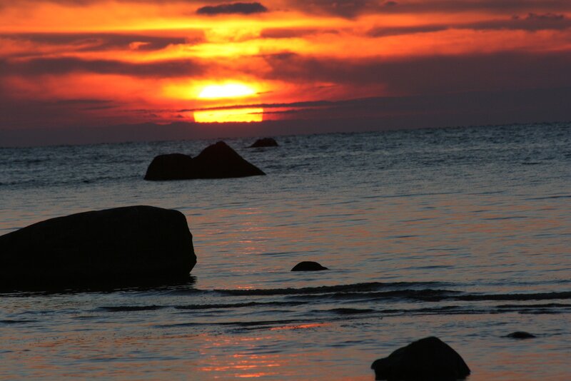 Silhouetted Rocks at Sunset — Orange, Dramatic, Photograph, Ocean