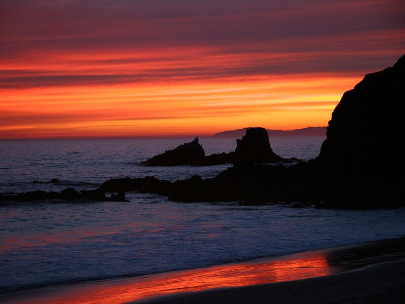 Silhouetted Rocks at Sunset — Orange, Dramatic