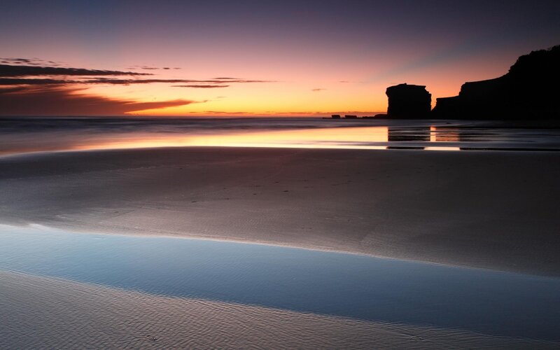 Silhouetted Rocks at Sunset — Orange, Serene, Photograph, Beach