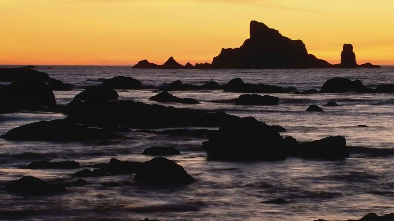 Silhouetted Rocks at Sunset — Orange, Serene, Photograph, Ocean, Sky, Yellow