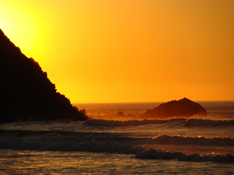 Silhouetted Rocks at Sunset — Orange, Serene, Photograph, Ocean