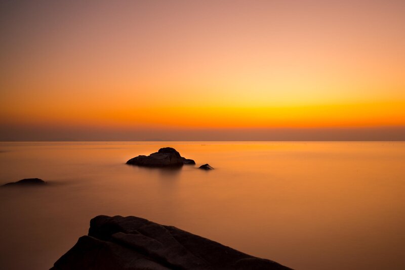 Silhouetted Rocks at Sunset — Orange, Serene, Photograph, Sea, Sky
