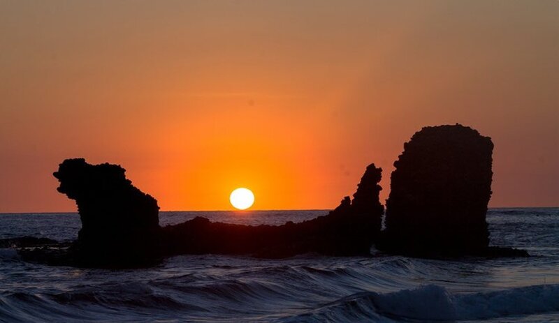 Silhouetted Rocks at Sunset — Orange, Serene, Photograph, Sun