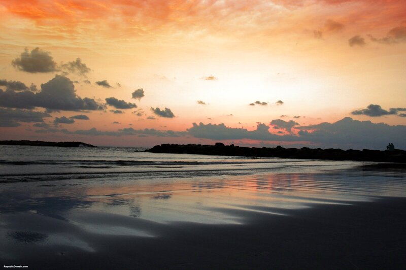 Silhouetted Rocks at Sunset — Orange, Serene, Photograph
