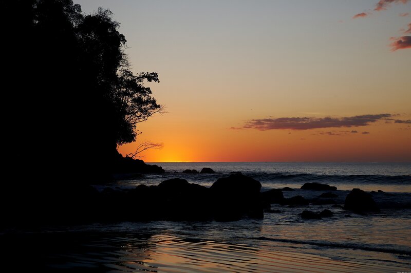 Silhouetted Rocks at Sunset — Orange, Serene, Photograph, Trees