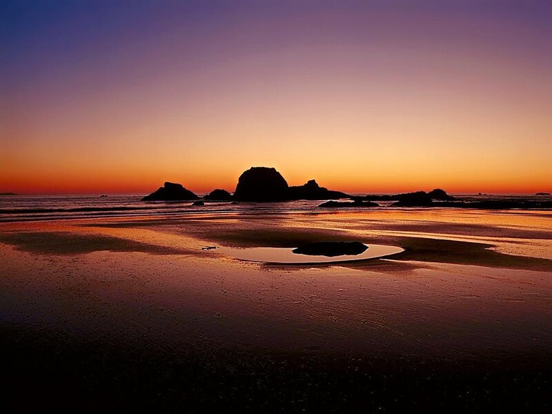 Silhouetted Rocks at Sunset — Orange, Serene