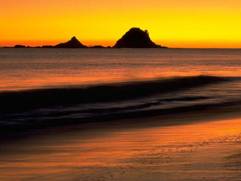 Silhouetted Rocks at Sunset — Orange