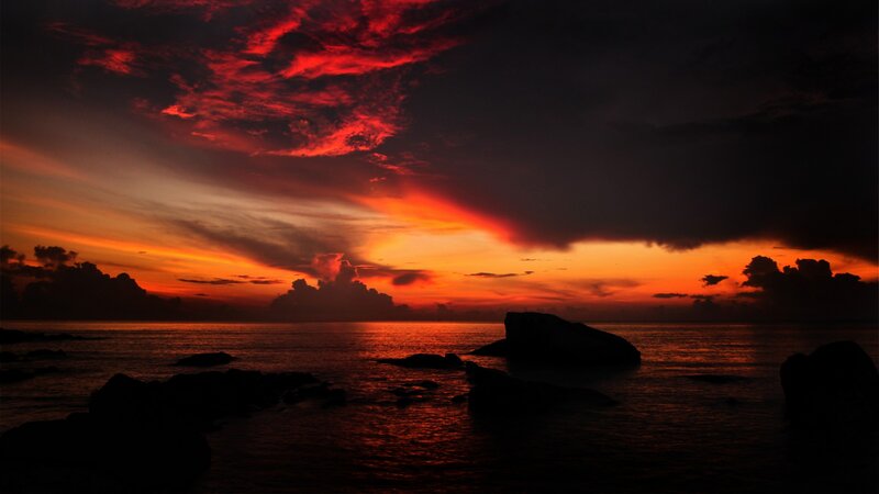 Silhouetted Rocks at Sunset — Red, Dramatic