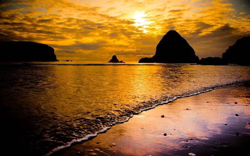 Silhouetted Rocks at Sunset — Yellow, Dramatic, Photograph