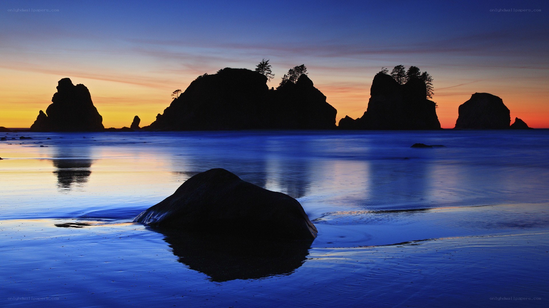 Silhouetted rocks at sunset