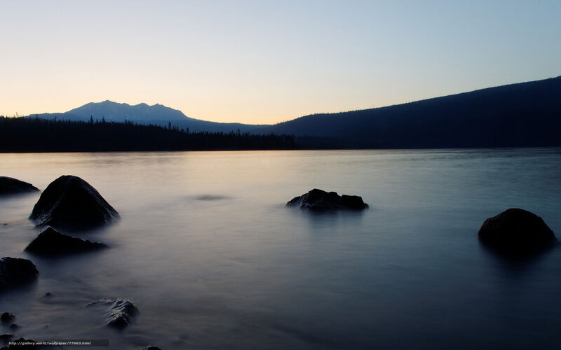 Silhouetted Rocks in Lake
