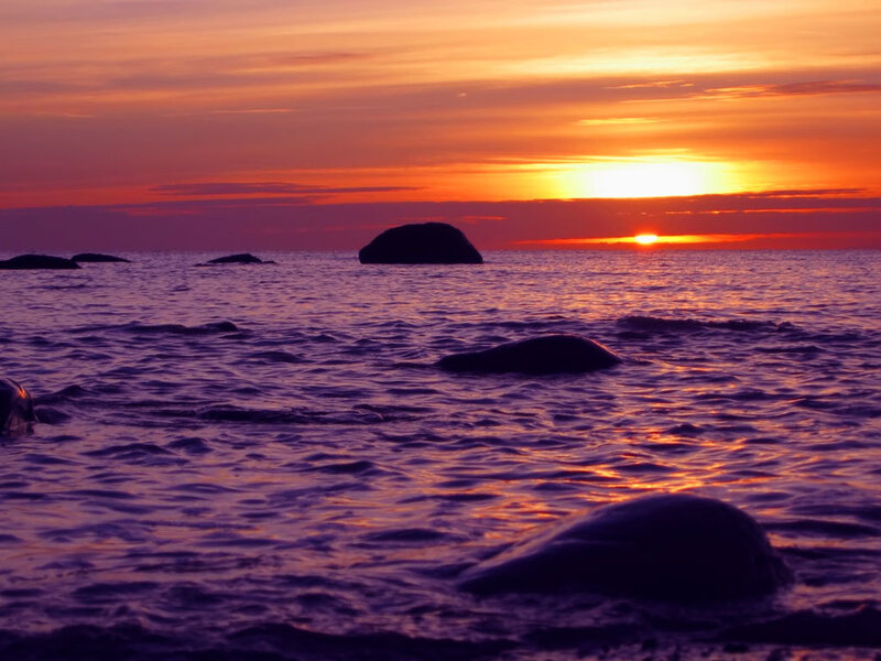 Silhouetted Rocks in Sea