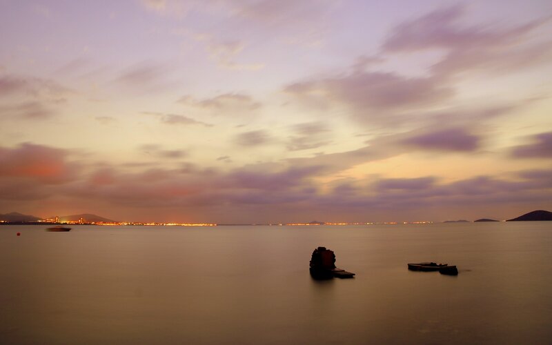 Silhouetted Rocks in Water — Purple, Serene