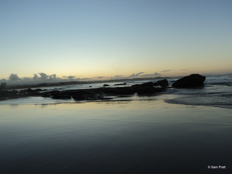 Silhouetted Rocks on Beach — Blue