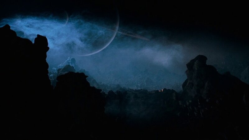 Silhouetted Rocks under Planet