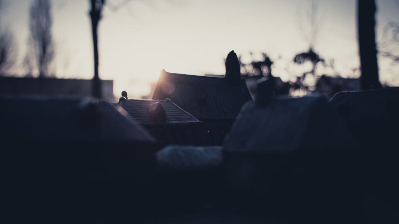 silhouetted rooftops at dusk